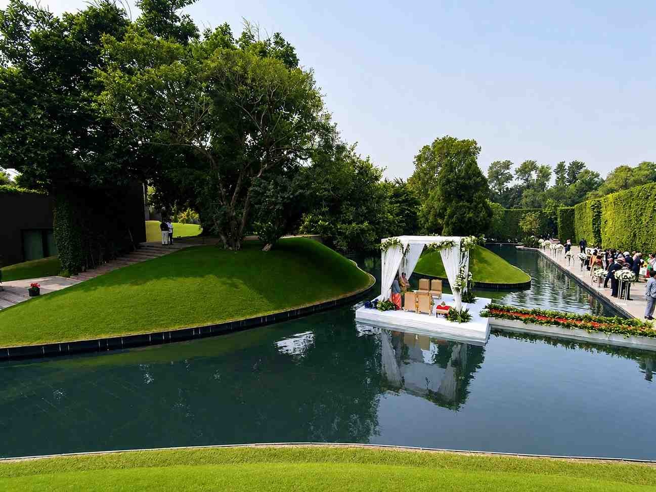 Scenic waterfront wedding venue at The Roseate New Delhi with lush gardens and premium event spaces.