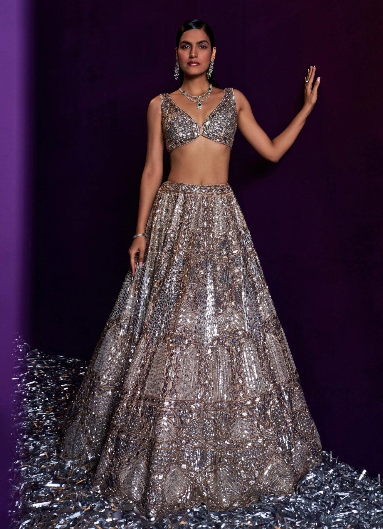 Bridal lehenga in blush pink with minimal embroidery and lightweight fabric, ideal for sustainable wedding fashion.