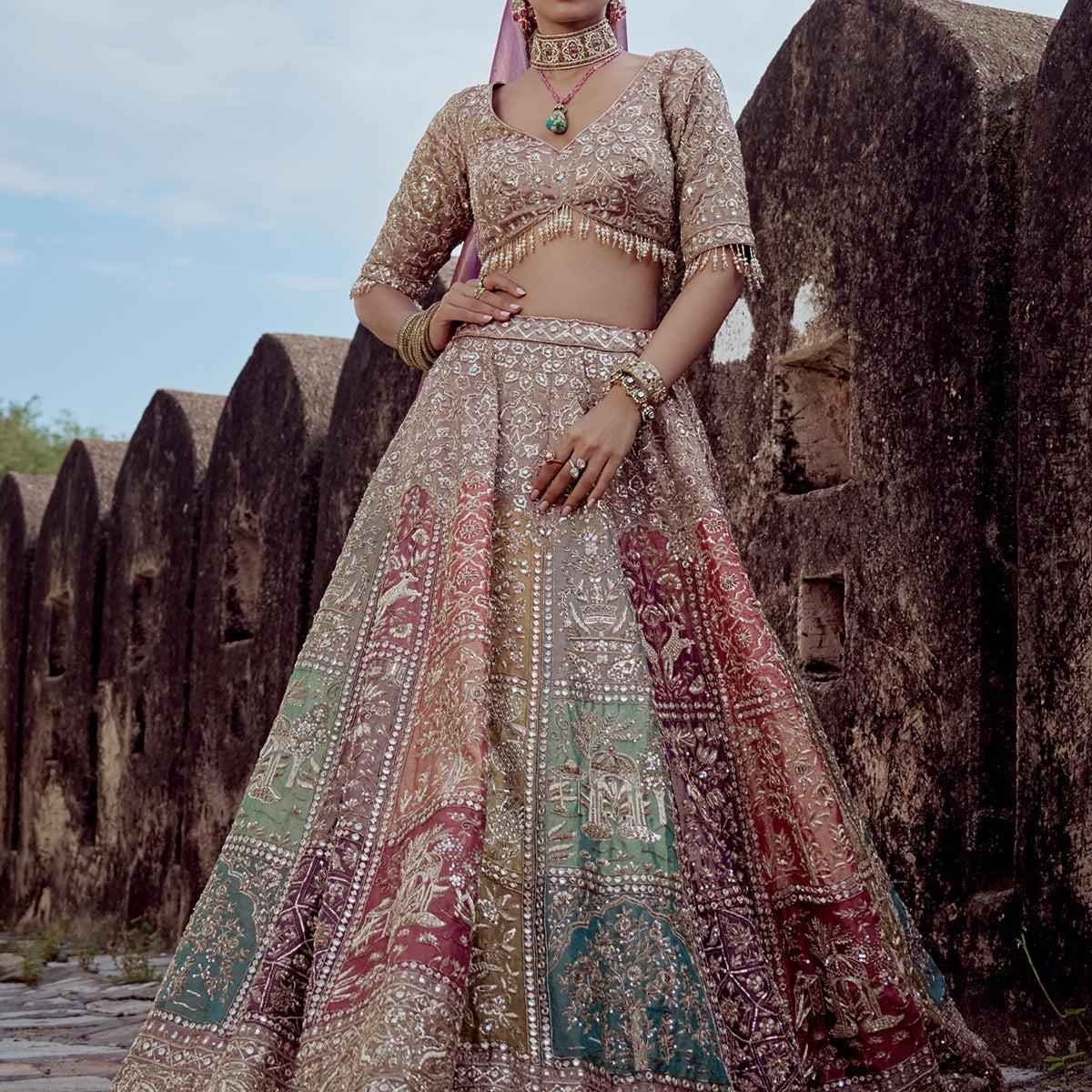 Wedding Bridal lehenga featuring multi-panel embroidery, intricate threadwork, and a modern sleeveless blouse design.