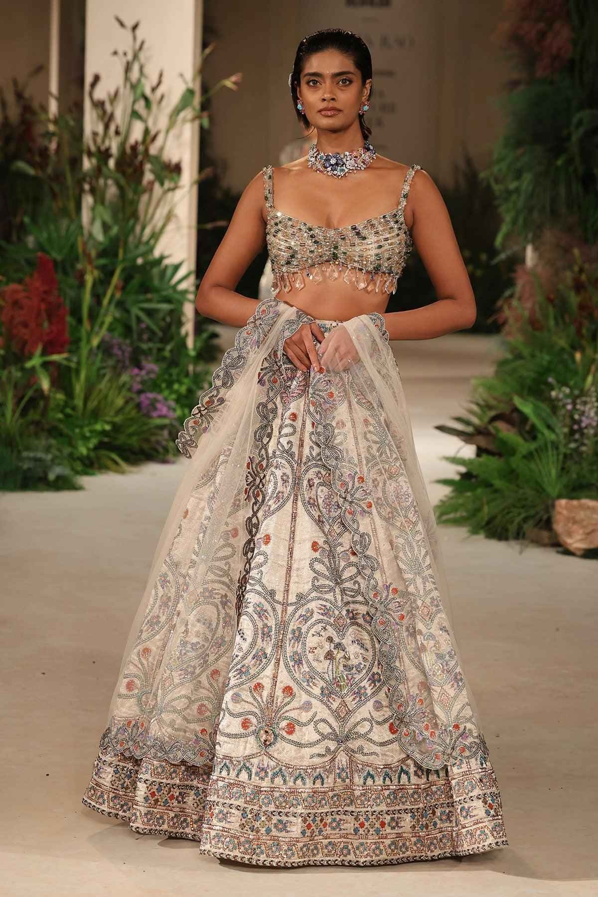 Beatufull bridal lehenga in metallic pastel tones with mirror embellishments