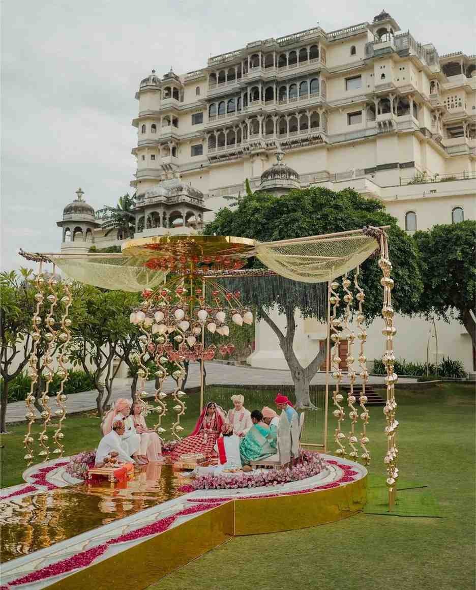 Luxury destination wedding ceremony at a royal palace venue in Udaipur, Rajasthan with elegant mandap decor and traditional Indian wedding rituals.